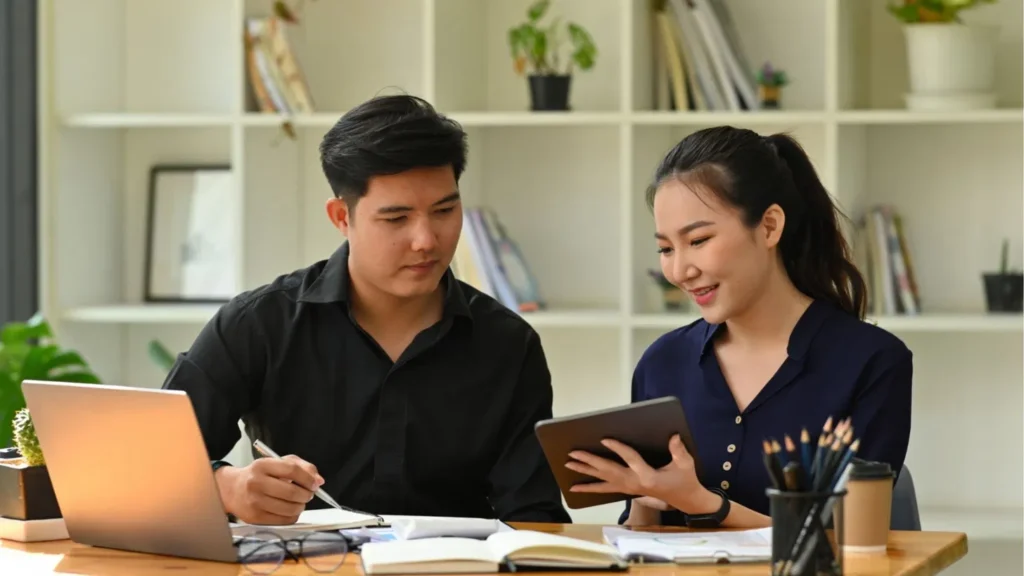 Business owner conducting a virtual assistant performance review based on completed work and feedback